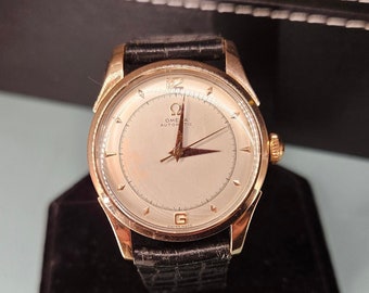 Omega watch mint dial 1950s two Tone, Rose Gold and stainless. Watch keeps good time see timegrapher picture