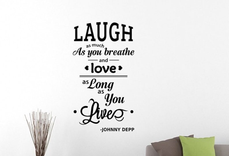 Puede incluir: Cita tipogr&aacute;fica en blanco y negro sobre fondo blanco. La cita dice "LAUGH as much As you breathe and <love> as Long as You Live" -JOHNNY DEPP.