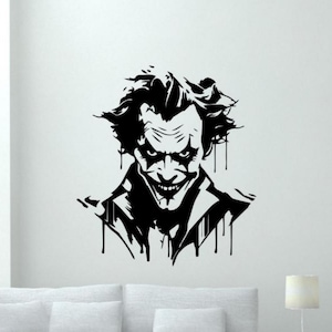 May include: Black and white silhouette of the Joker, a comic book villain, with a wide, menacing grin. The image is stylized with dripping paint effects.
