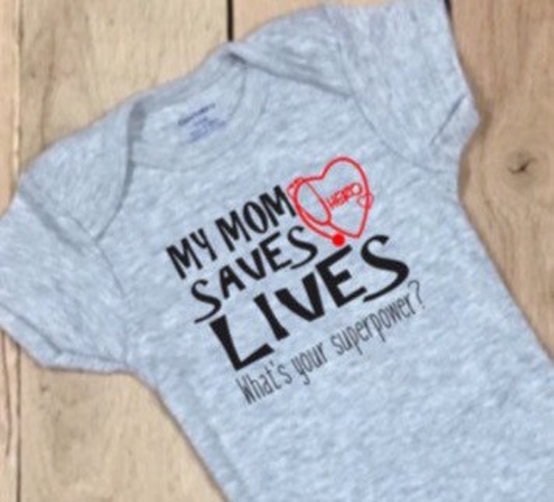 My mom saves lives nurse pandemic 2020 nurse pregnancy reveal baby onesie\u00ae pandemic pregnancy announcement boy bodysuit girl bodysuit