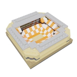 May include: A Lego model of a stadium with a checkerboard pattern in orange and white. The stadium has a gray roof and is made of plastic.