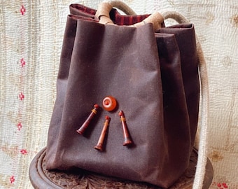 Crossbody shoulder bag organic cotton oilskin  with naga bone trumpet and amber decoration