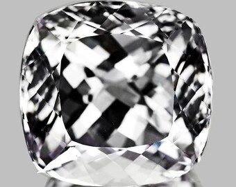 May include: A faceted, cushion-cut gemstone with a brilliant, reflective surface. The gem features a complex pattern of internal reflections, showcasing a mix of white and dark gray tones. The overall shape is square with rounded corners, set against a gray background.