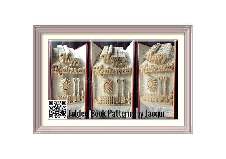 May include: Three book sculptures of houses with the words "Happy Retirement" on the front. The sculptures are framed in a light brown frame. The text "Folded Book Patterns by Jacqui" is below the sculptures.