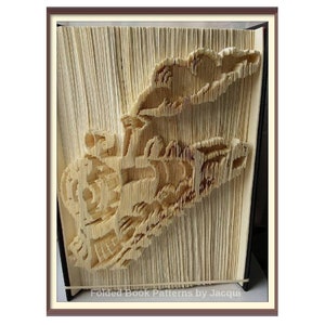 May include: A book art sculpture of a train made by folding the pages of a book. The book is bound in black and the pages are a cream colour. The sculpture is titled "Folded Book Patterns by Jacqui".