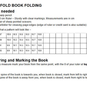 May include: A black and white diagram showing how to measure and mark a book for folding. The diagram includes a grid with measurements in centimeters and instructions for marking the book based on the spine's position.