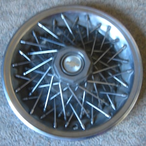 Chevy Caprice 1980 Wire Wheel Hub Cap.