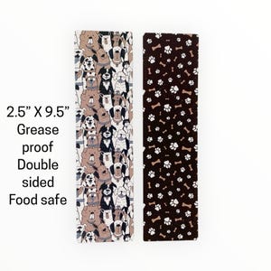 May include: Two rectangular, double-sided food-safe sheets, each 2.5" x 9.5". One features a repeating pattern of various dog breeds in brown, black, and white. The other has a brown background with white paw prints and bones.