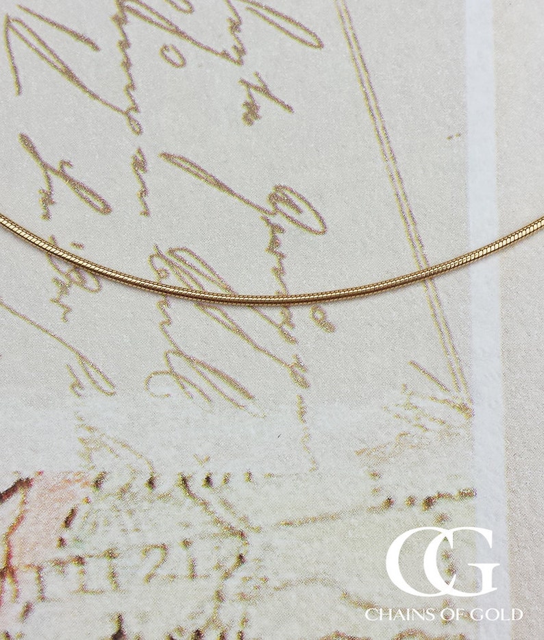 Universal Jewels Solid 14K Yellow Gold Round Snake Chain Necklace 0.8mm Width & 20 inches in Length Universal Jewels Solid 14K Yellow Gold Round Snake Chain Necklace 0.8mm Width & 20 inches in Length