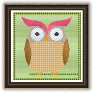 May include: A cross-stitch pattern featuring a brown and beige owl with pink ears and large white eyes. The owl is sitting on a green and white checkered background.