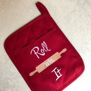 Roll with it. Oven mitt with black rubber backing.