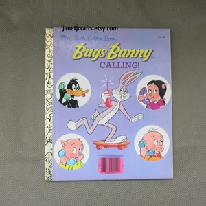 May include: A vintage Little Golden Book titled "Bugs Bunny Calling!" featuring Bugs Bunny on a skateboard, Daffy Duck, Porky Pig, and Tweety Bird on the phone.