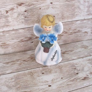 Vintage angel figurine September birthay holding blue roses blonde hair JanetJcrafts