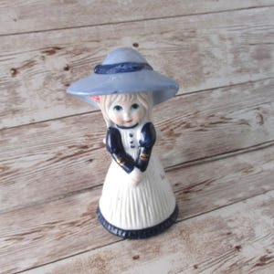 Vintage Dutch Girl hand bell Blue bonnet white dress with flowers ceramic Girl figurine Table center piece JanetJcrafts