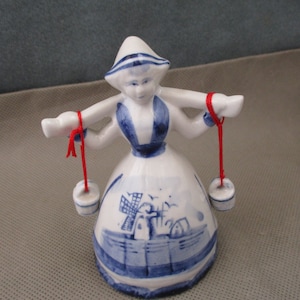 Vintage Dutch Girl carrying water buckets, Porcelain Figurine hand Bell, Blue White JanetJcrafts