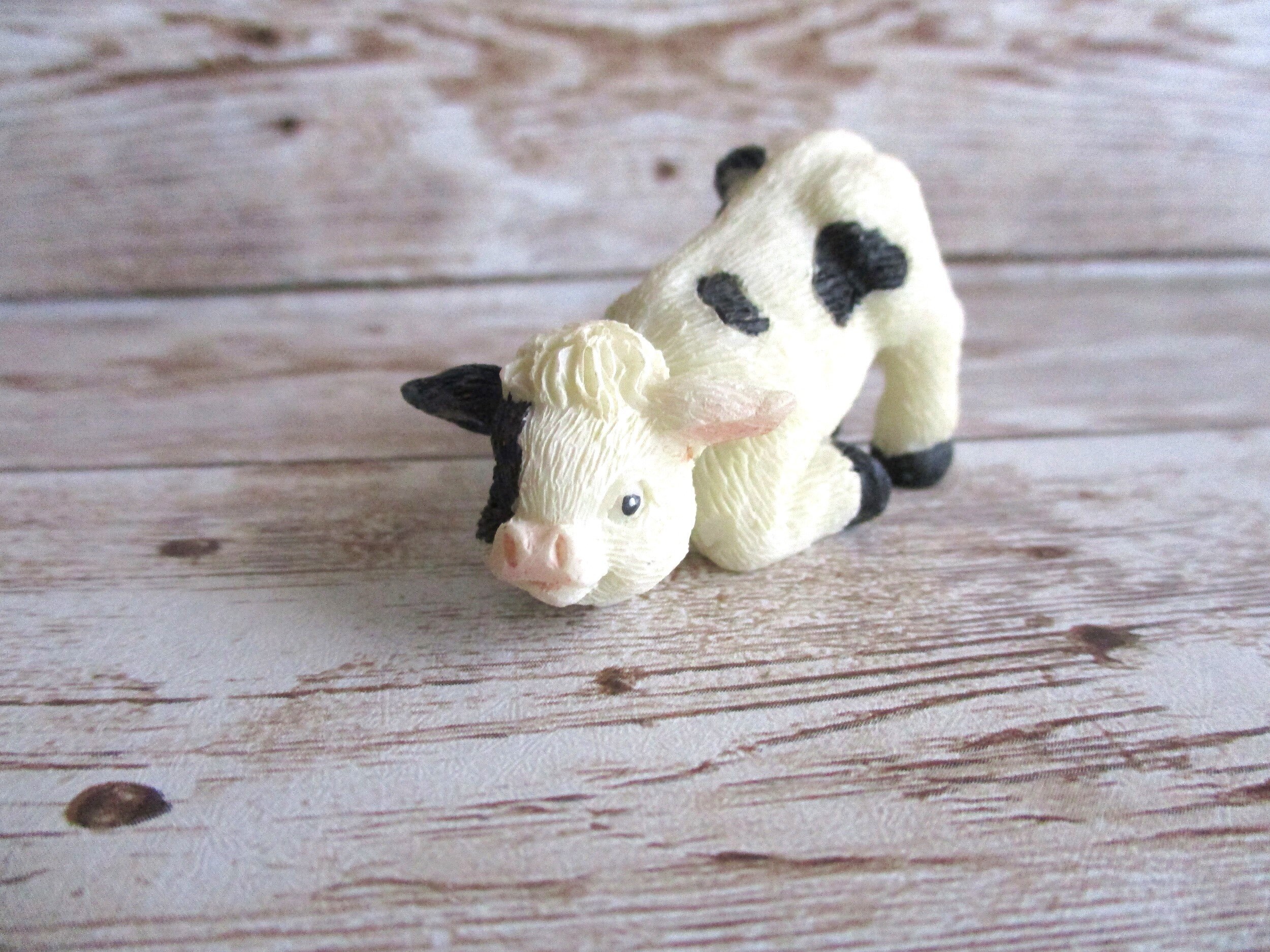Vintage mini Holstein cow figurine lying down Nativity scene baby cow black and white JanetJcrafts