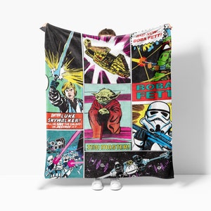 a star wars themed blanket hanging on a wall