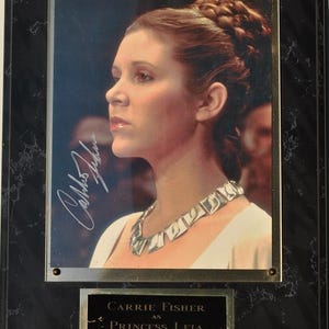 Star Wars - Placa firmada por Carrie Fisher con certificado de autenticidad