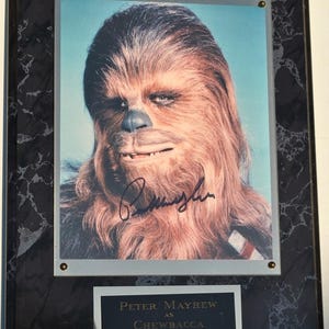 Star Wars - Placa firmada por Peter Mayhew con certificado de autenticidad