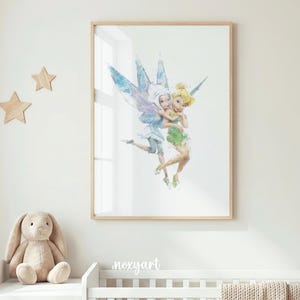 May include: A framed watercolour print of two fairies, one with blonde hair and a green dress, the other with white hair and a blue dress, embracing. The print is in a light wood frame, suitable for a nursery or child's room.