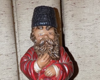 A Russian Vodka Decanter.(ALBERTA 1970) A 2 P.C. Ceramic Russian Man Figurine w/ a Red Robe and Beard, Nice Addition For Your Bar Collection