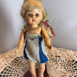 Mid Century Hard Plastic Doll 7.5 inches 1950s Blonde Sleep Eye possible Pam Doll or Cosmopolitan Doll