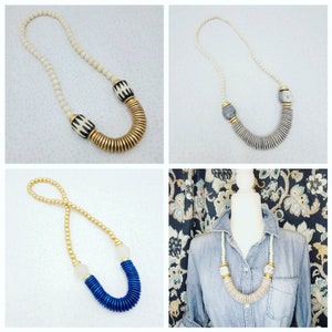 Statement disc necklace with gold accents and bone beads or recycled glass beads.
