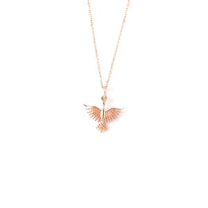 May include: A delicate gold necklace with a small, detailed bird pendant. The bird has spread wings and is made of a textured metal.
