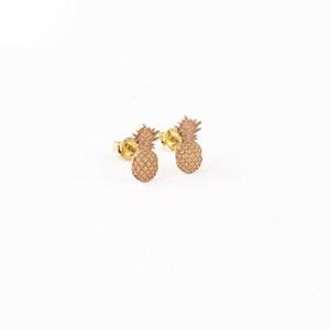 May include: A pair of gold pineapple stud earrings. The earrings are small and delicate, and they would make a great gift for someone who loves pineapples.