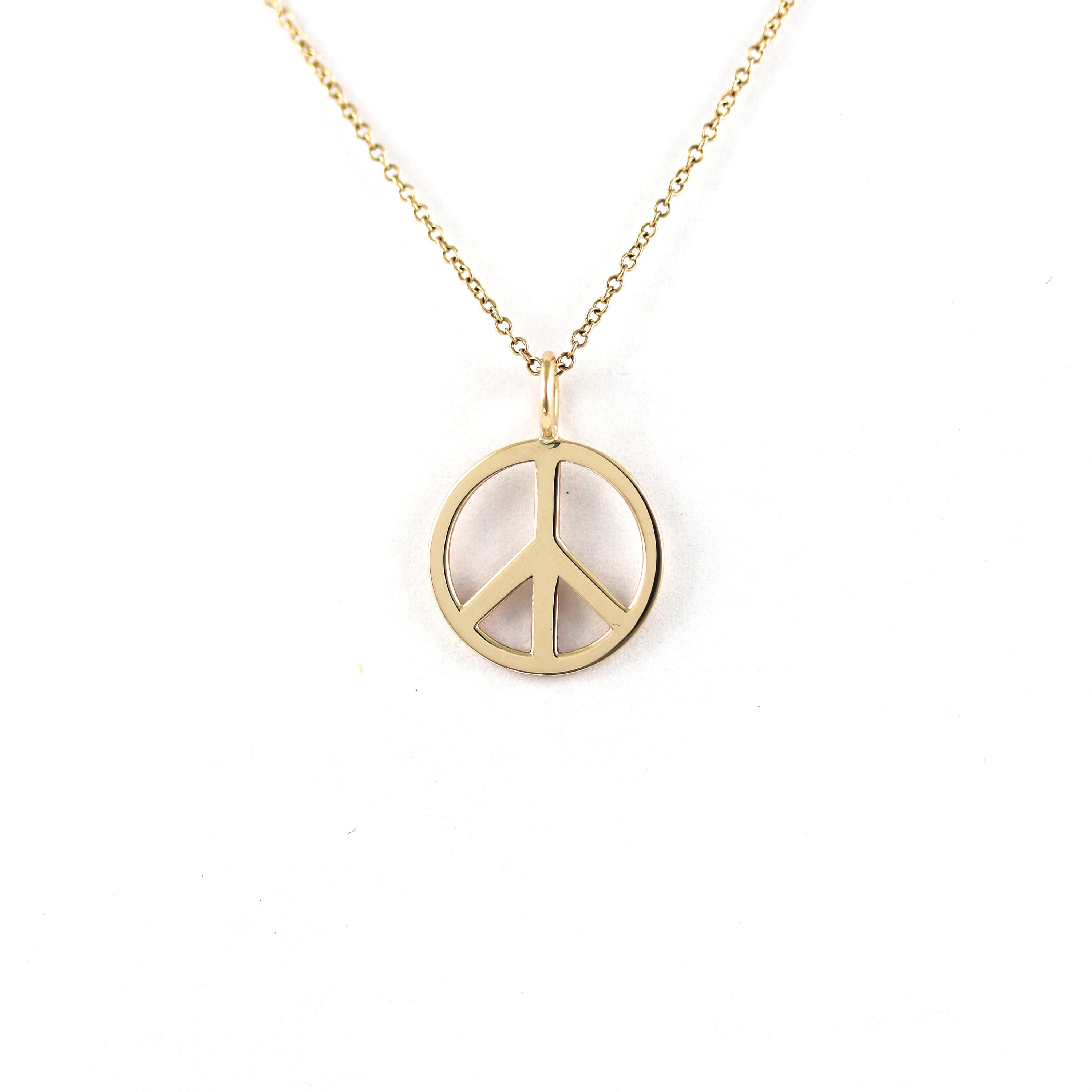 Gold peace best sale pendant