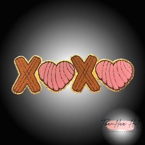 May include: A brown and pink felt applique with the letters "XOXO" and two hearts. The applique is outlined in gold glitter.