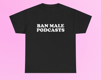 May include: Black t-shirt with the white text "BAN MALE PODCASTS" in a bold, sans-serif font. The shirt is displayed against a pink background, highlighting the text. The t-shirt is a casual wear item.