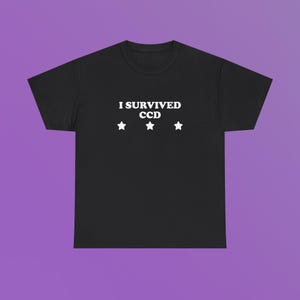 I Survived CCD Unisex Heavy Cotton Tee Y2K Shirt Cute Top Sassy Edgy Sarcastic Funny Viral Unhinged Meme Chaotic Iconic Ironic Phrase Gift