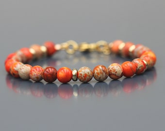 Bracelet Jaspe Impérial orange pour Femme. Perles rondes sur fil câblé. Apprêts acier inoxydable doré