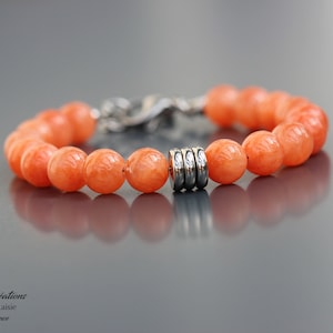 Orange jade bracelet for women. Stainless steel clasp