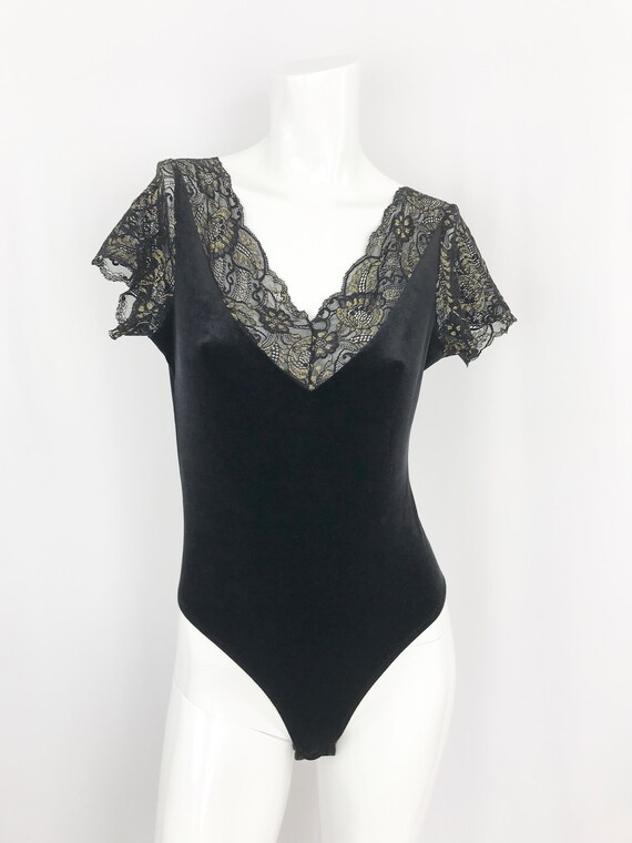 black and gold bodysuit