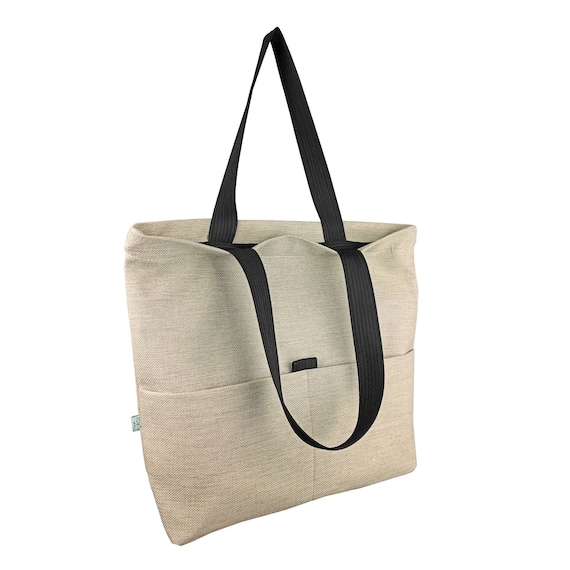 Bolso shoping grande de tela, totebag con cremallera de doble asa, forrado  y con bolsillos.