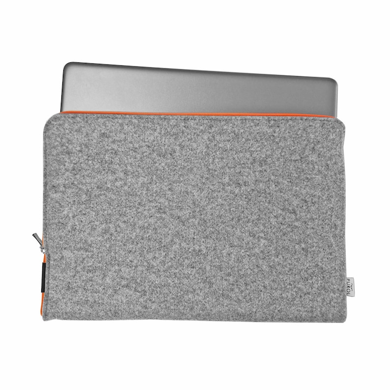 Front photo of light grey felt case with laptop inside. Orange zipper opens on the side and top of the case. Durable felt, case made to fit your laptop's size.