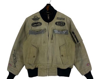 Chaqueta bomber vintage con cremallera de la NHRA (Asociación Nacional de Hot Rods) para carreras de aceleración y deportes de motor.