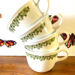 4 Corning Spring Blossom Ring Handle Coffee Cups, Four CorningWare Crazy Daisy Coffee Mugs, Corelle Livingware Spring Blossom Mugs