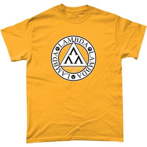 May include: A yellow t-shirt with a black and white circle logo. The logo features a triangle with three upside down V's inside. The circle has the text "Lambda" written around it. The text "Adams College" and "1904" are written inside the triangle.