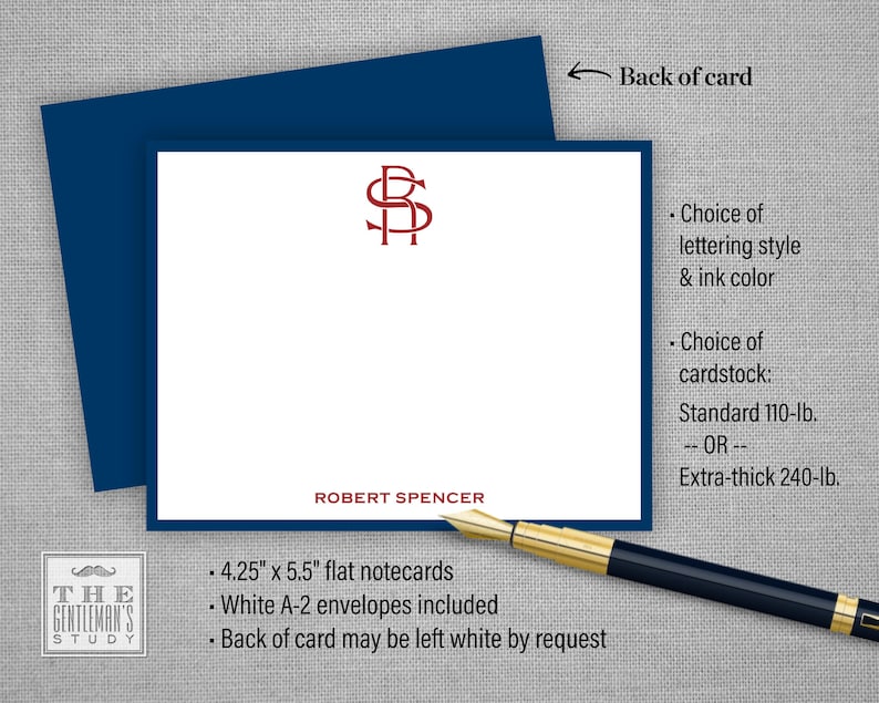 May include: A white flat notecard with a navy blue border and a red monogram of the letters "RS". The text "ROBERT SPENCER" is printed below the monogram. The card is 4.25 inches by 5.5 inches and includes white A-2 envelopes. The back of the card may be left white by request. The card is available in a choice of lettering styles and ink colors, and in standard 110-lb. or extra-thick 240-lb. cardstock.