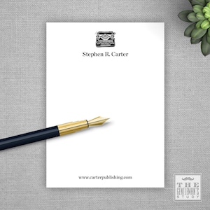 May include: White stationery with a black typewriter illustration, the text "Stephen R. Carter" and the website address "www.carterpublishing.com". The stationery is on a gray textured surface.