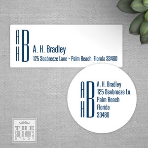 May include: A white rectangular return address label with blue lettering. The label reads "A. H. Bradley, 125 Seabreeze Lane, Palm Beach, Florida 33480". The letters "A, H, B" are stacked vertically in a larger font size.