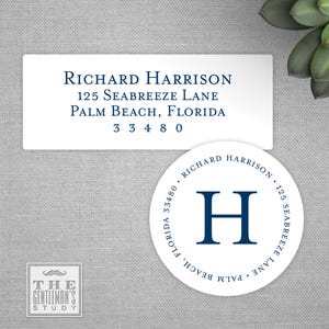 May include: White rectangular and circular labels with navy blue text. The rectangular label displays a name and address. The circular label features a monogram and address details. The Gentleman's Study logo is in the lower left.