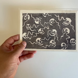 Skull and snakes linocut print