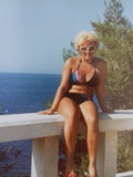 Vintage  beach color photo of  beautiful woman in swimsuit product logo