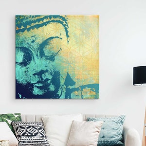 May include: An abstract painting of a Buddha face in teal and gold colours. The background is a textured gold with a geometric pattern.
