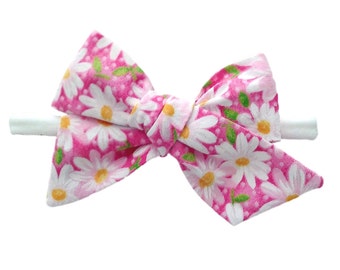 Pink bows with daisies, for babies and toddlers, for newborns and little girls, on nylon headband