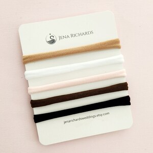 JenaRichardsWeddings offers baby hair bows on your choice of a nude, white, pink, brown or black nylon band